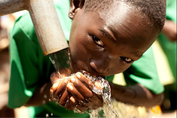 african child drinking clean water